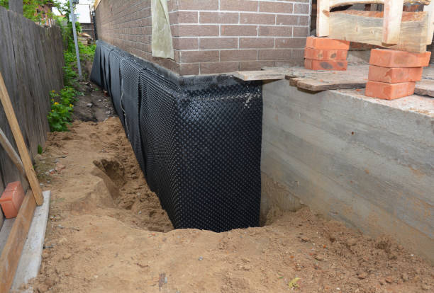 Happy homeowners after waterproofing job in Sharon Center